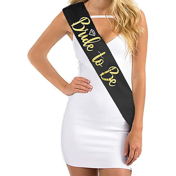 Be the star of your bridal shower with our Bride-to-Be Sash with Gold Lettering